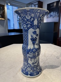 A pair of Chinese blue and white 'gu' vases with floral design, Kangxi