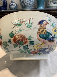 A fine Chinese famille rose bowl with figures, flowers and pheasants, Yongzheng/Qianlong