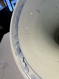 A pair of Chinese blue and white 'gu' vases with floral design, Kangxi