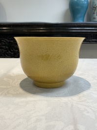 A Chinese yellow-glazed 'anhua' 'carp and lotus' bowl, Kangxi mark, 19th C.