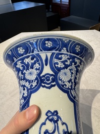 A pair of Chinese blue and white 'gu' vases with floral design, Kangxi