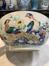 A fine Chinese famille rose bowl with figures, flowers and pheasants, Yongzheng/Qianlong