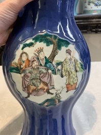 A pair of Chinese famille verte blue-ground lobed vases with figural design, 19th C.