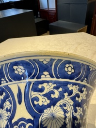 A pair of Chinese blue and white 'gu' vases with floral design, Kangxi