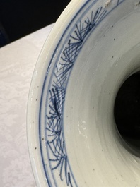 A pair of Chinese blue and white 'gu' vases with floral design, Kangxi