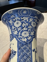A pair of Chinese blue and white 'gu' vases with floral design, Kangxi