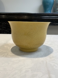 A Chinese yellow-glazed 'anhua' 'carp and lotus' bowl, Kangxi mark, 19th C.
