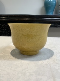 A Chinese yellow-glazed 'anhua' 'carp and lotus' bowl, Kangxi mark, 19th C.