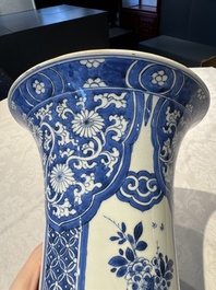 A pair of Chinese blue and white 'gu' vases with floral design, Kangxi