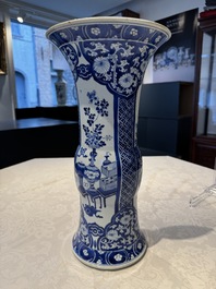 A pair of Chinese blue and white 'gu' vases with floral design, Kangxi