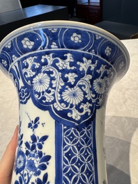 A pair of Chinese blue and white 'gu' vases with floral design, Kangxi