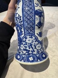 A pair of Chinese blue and white 'gu' vases with floral design, Kangxi