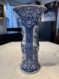 A pair of Chinese blue and white 'gu' vases with floral design, Kangxi