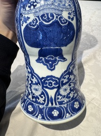 A pair of Chinese blue and white 'gu' vases with floral design, Kangxi