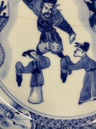 A pair of Chinese blue and white 'dragon' plates and a plate with narrative design, Yuzhen mark, Kangxi/Yongzheng