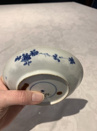 A Chinese gilt iron-red saucer and a blue and white saucer, Johanneum marks, ex-collection of August the Strong, Kangxi