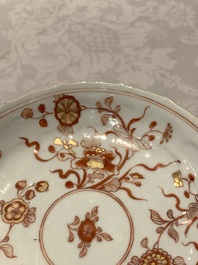 A Chinese gilt iron-red saucer and a blue and white saucer, Johanneum marks, ex-collection of August the Strong, Kangxi