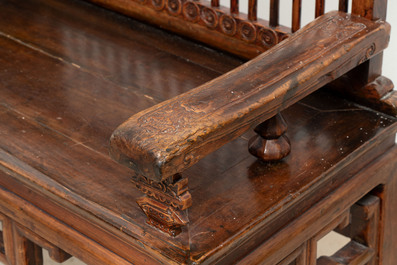 A Chinese carved and lacquered wooden bench, 19th C.