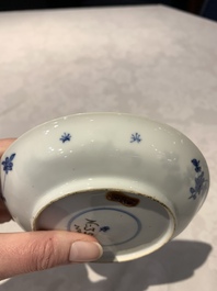 A Chinese gilt iron-red saucer and a blue and white saucer, Johanneum marks, ex-collection of August the Strong, Kangxi