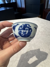 Two Chinese blue and white cups and saucers, Kangxi/Yongzheng
