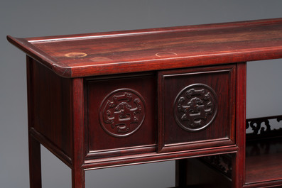A Chinese carved wooden cabinet with chilong design, 20th C.