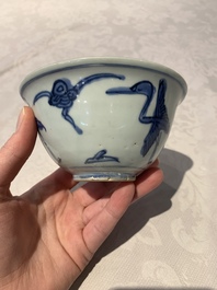 Four Chinese blue and white bowls, two cups and a plate, Ming