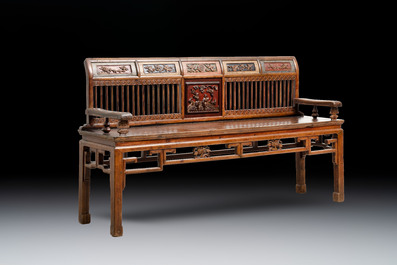 A Chinese carved and lacquered wooden bench, 19th C.
