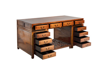 A Chinese wooden desk with drawers and a footrest, 19/20th C.