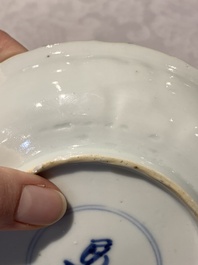 A Chinese gilt iron-red saucer and a blue and white saucer, Johanneum marks, ex-collection of August the Strong, Kangxi