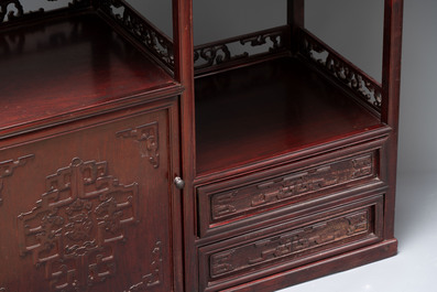 A Chinese carved wooden cabinet with chilong design, 20th C.