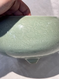 A Chinese celadon-glazed tripod censer with 'anhua' floral design, Kangxi