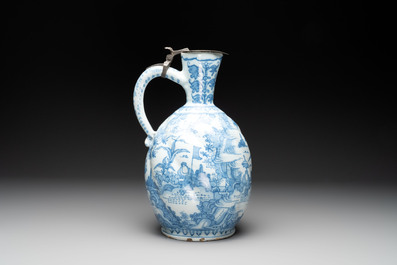 A large blue and white Dutch Delft chinoiserie jug with a mounted pewter lid, 17th C.
