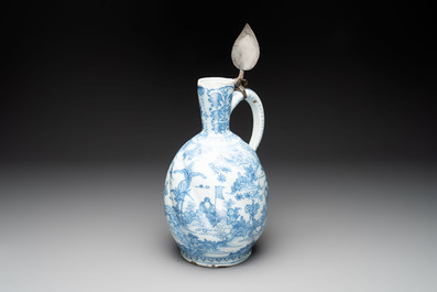 A large blue and white Dutch Delft chinoiserie jug with a mounted pewter lid, 17th C.