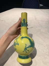 A Chinese wucai 'flying horse' jar, a green-enamelled yellow-ground 'dragon' vase and a Nanking crackle-glazed jar, 19th C.