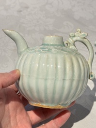 A pair of Chinese qingbai ewers and covers with dragon-form handles, Song/Yuan