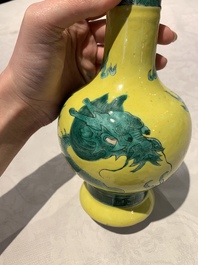 A Chinese wucai 'flying horse' jar, a green-enamelled yellow-ground 'dragon' vase and a Nanking crackle-glazed jar, 19th C.