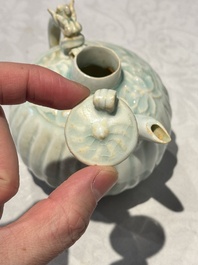 A pair of Chinese qingbai ewers and covers with dragon-form handles, Song/Yuan