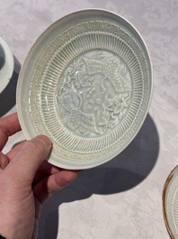 A pair of Chinese qingbai 'crane' plates and a tea bowl with stand, Song/Yuan