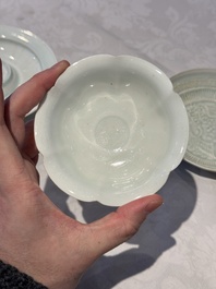 A pair of Chinese qingbai 'crane' plates and a tea bowl with stand, Song/Yuan