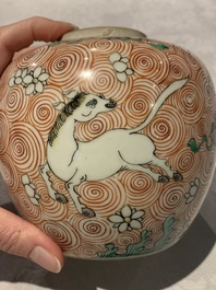 A Chinese wucai 'flying horse' jar, a green-enamelled yellow-ground 'dragon' vase and a Nanking crackle-glazed jar, 19th C.