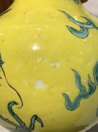 A Chinese wucai 'flying horse' jar, a green-enamelled yellow-ground 'dragon' vase and a Nanking crackle-glazed jar, 19th C.