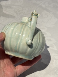 A pair of Chinese qingbai ewers and covers with dragon-form handles, Song/Yuan