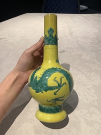 A Chinese wucai 'flying horse' jar, a green-enamelled yellow-ground 'dragon' vase and a Nanking crackle-glazed jar, 19th C.