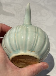 A pair of Chinese qingbai ewers and covers with dragon-form handles, Song/Yuan