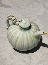 A pair of Chinese qingbai ewers and covers with dragon-form handles, Song/Yuan