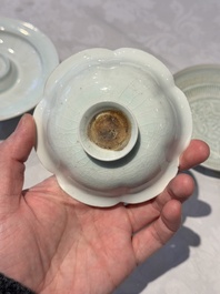 A pair of Chinese qingbai 'crane' plates and a tea bowl with stand, Song/Yuan