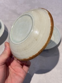 A pair of Chinese qingbai 'crane' plates and a tea bowl with stand, Song/Yuan