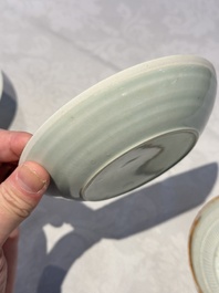 A pair of Chinese qingbai 'crane' plates and a tea bowl with stand, Song/Yuan