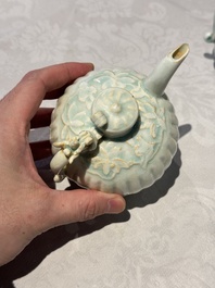 A pair of Chinese qingbai ewers and covers with dragon-form handles, Song/Yuan