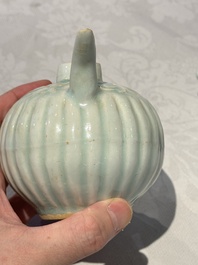 A pair of Chinese qingbai ewers and covers with dragon-form handles, Song/Yuan